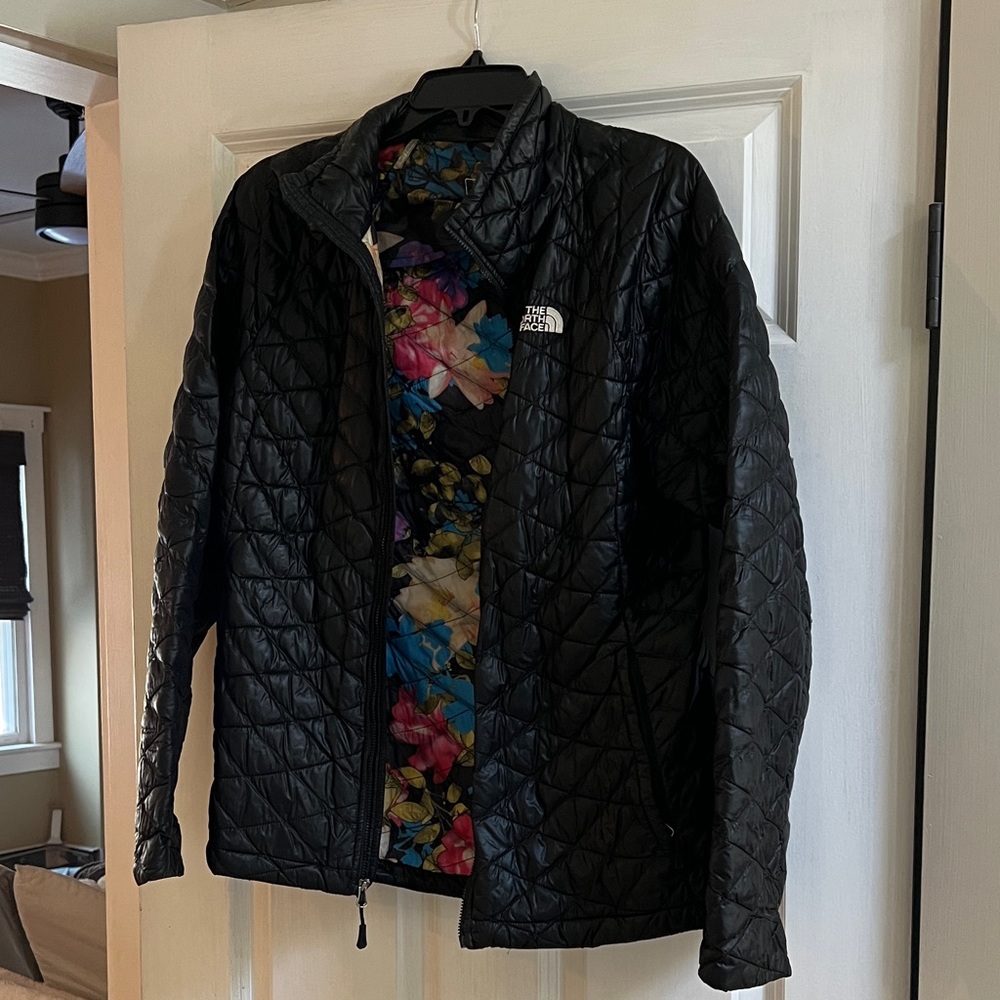 The North Face Women's Black Thermo Ball Jacket with floral on inside
